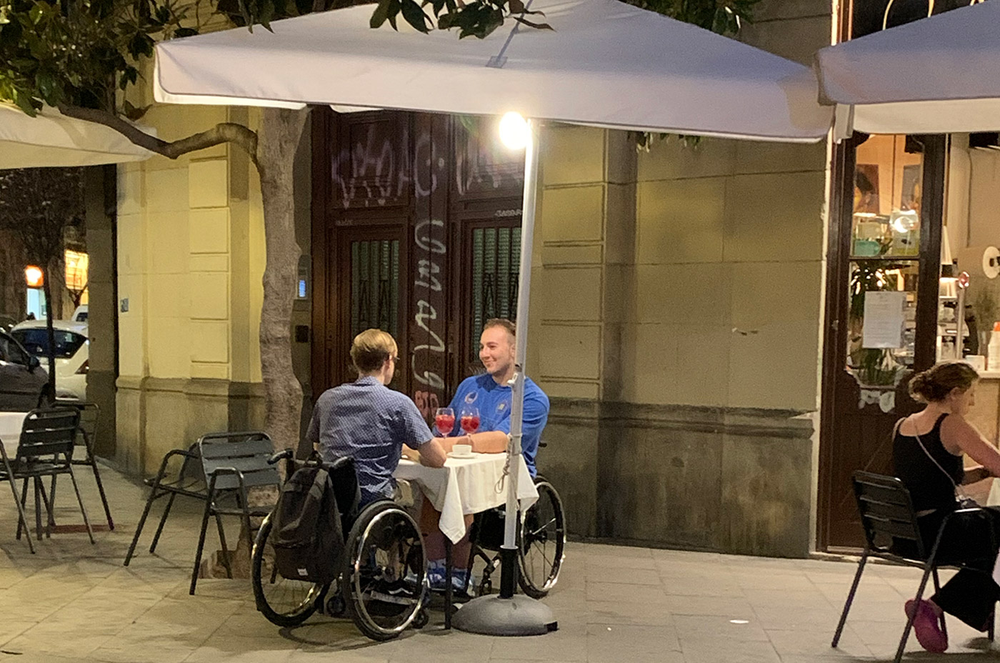 2 guys in a wheelchair